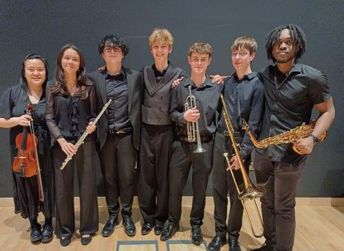 A selection of Peter Symonds music students celebrate their conservatoire offers